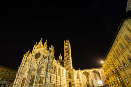 Night view of Siena Cathedral Santa Maria Assunta (Duomo di Siena) in Siena, Tuscany, italy.  Italian landmarkの写真素材