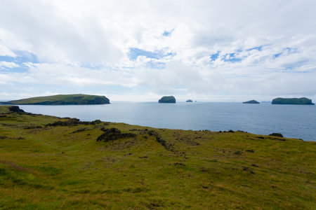 Vestmannaeyjar island beach view with Surtsey island in the background. Iceland landscapeの写真素材