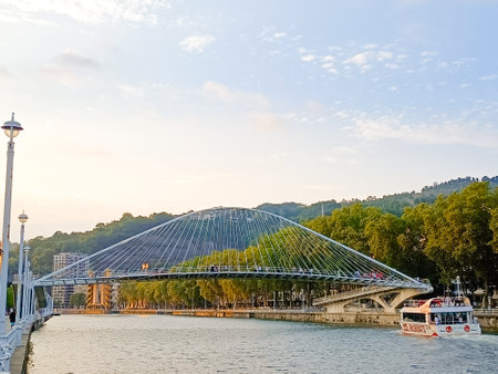 Zubizuri footbridge across Nervion river, Bilbao, Spain. Tied arch bridge. Campo Volantin Bridgeの写真素材