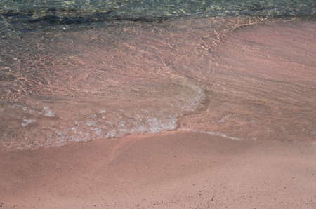 Beaches in Elafonisi, Crete island  have the particularity to be colored pink because of the coral fragments accumulated on the shoreの写真素材