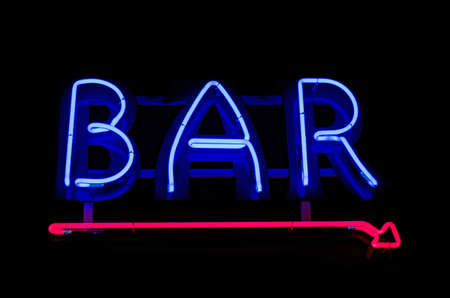 Vintage neon sign over the bar doorの写真素材