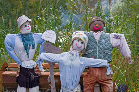 Scarecrow famil shoving sign with message for respectの写真素材