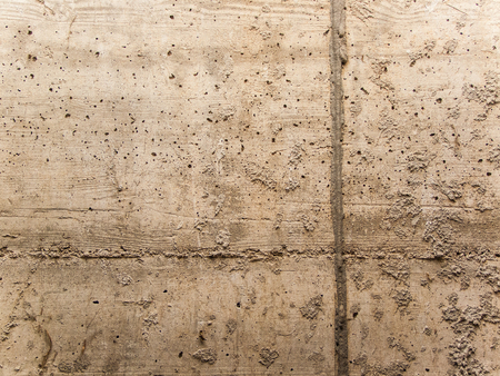 concrete wall with gray line and a lot of holesの写真素材