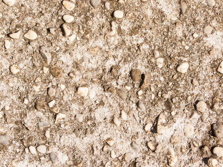 raw concrete with gravel in sightの写真素材