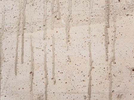 white concrete wall with gray dropsの写真素材