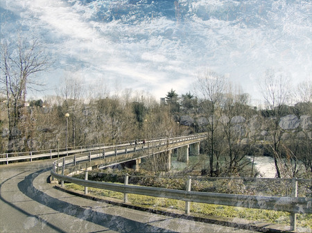 bridge over a river in a mountain landscape double exposureの写真素材