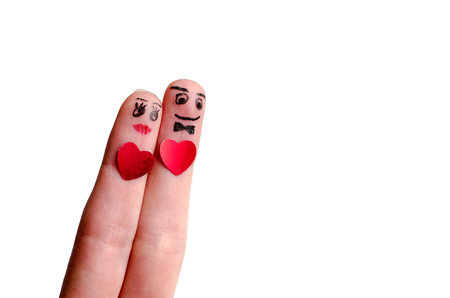 Two fingers couple with red hearts isolated on white background copy spaceの写真素材