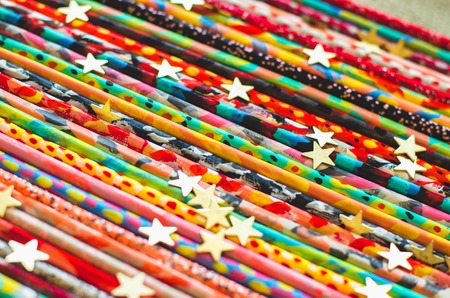 Colorful painted sticks bright vivid abstract background. Concept of different handmade stuffの写真素材