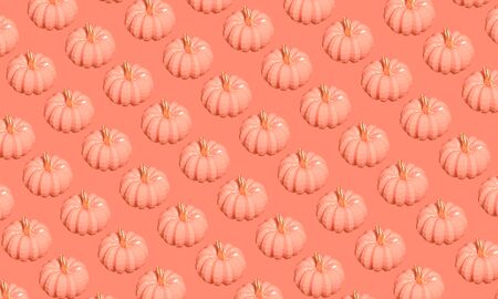 Lots of orange plastic pumpkins in low poly style pattern on coral background 3D illustrationの写真素材