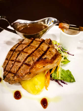 Delicious juicy meat steak served on a plate.のeditorial素材