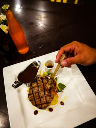 Delicious juicy meat steak served on a plate.のeditorial素材