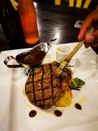Delicious juicy meat steak served on a plate.のeditorial素材
