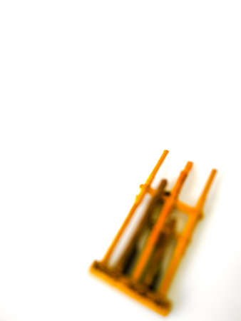 Blurry photo of Angklung is a traditional instrument from Indonesia, isolated on white background.の写真素材