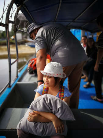 People sitting in a passenger boat waiting to be transported to Redang Island.の写真素材