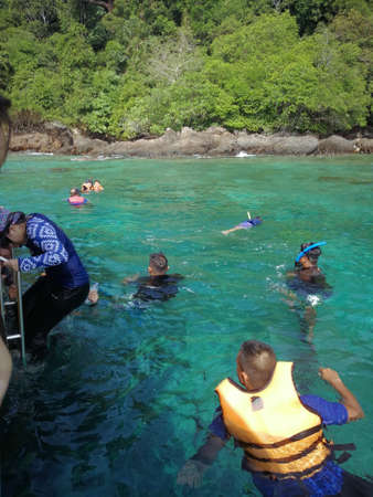Redang, Malaysia - June 20, 2018: People snorkeling in open water from the boat.のeditorial素材