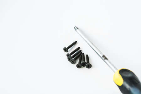 Black screws of self-tapping screws of same sizes isolated on white background.の写真素材