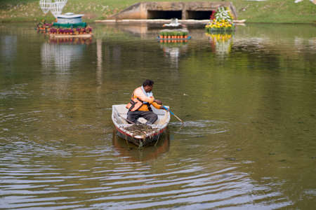 Putrajaya, Malaysia - September 6, 2019:  Workers cleaning the lake at the Royal Floria, Putrajaya.のeditorial素材