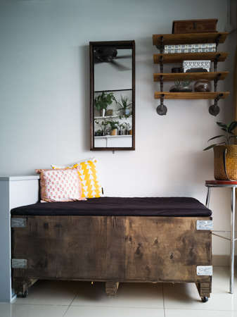 Daybed made from industrial box, with wooden industrial interior design.