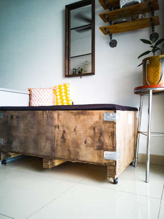 Daybed made from industrial box, with wooden industrial interior design.の写真素材
