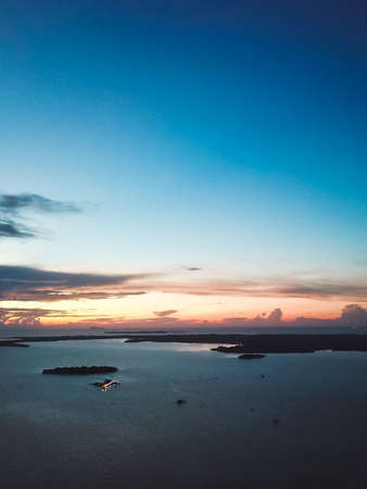 Aerial view of beautiful landscape near the island and sea gypsy water village with the water chalet stilt house during sunrise in Bum Bum island Semporna, Sabah, Malaysia.の写真素材