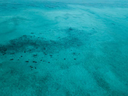 Aerial view of turquoise green sea in Bum Bum Island in Semporna, Sabah, Malaysia.