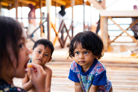 Semporna, Malaysia - NOvember 27, 2019: Children playing together at the water chalet resort in Egang - Egang near Pulau Bum Bum, Sabah.のeditorial素材