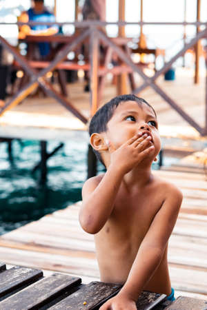 Semporna, Malaysia - NOvember 27, 2019: Portrait of a child in Egang - Egang near Pulau Bum Bum, Sabah.のeditorial素材