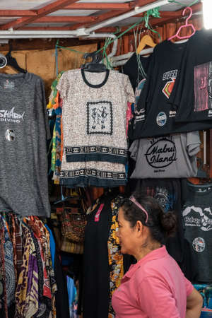Semporna, Malaysia - November 28, 2019 :  Local selling good to tourist near the dragon inn building, a tourist attraction.のeditorial素材