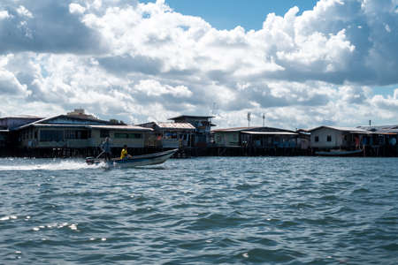 Semporna, Malaysia - November 28, 2019 :  Boats, houses, and jetty near the Semporna Town.のeditorial素材