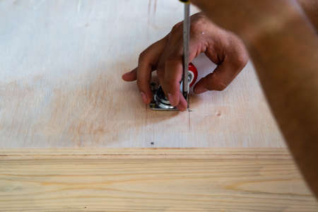 Fixing castor wheel to the wooden plywood, furniture making.