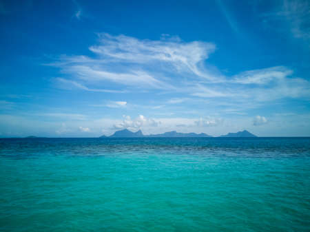 White sand beach turquoise sea water against blue sky with cloud seascape vacation background...