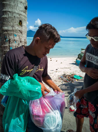 Semporna, Malaysia - November 26, 2019: Bajau Laut people in their village in Sibuan island,...
