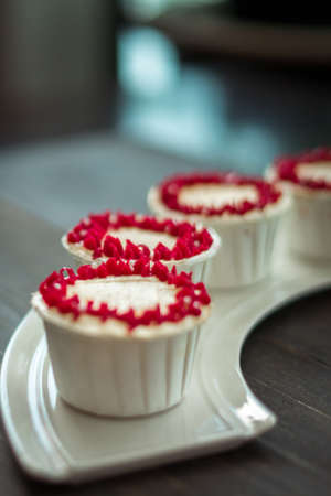 Beautiful cup cakes flowers from butter cream, in red and pink colour. Suitable for Birthday,...
