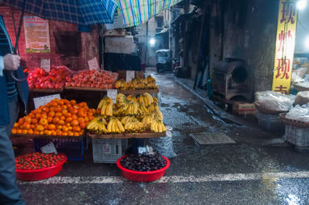 WUHAN,CHINA - April 4, 2019 - Fruit stall open in the early morning during rainy season.のeditorial素材