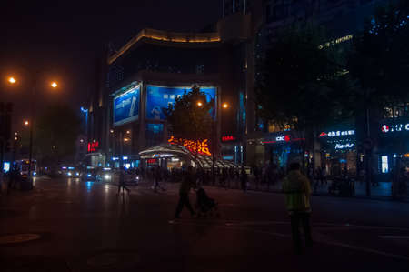 WUHAN,CHINA - April 4, 2019 - night scenic view  of Shopping street in Wuhan. Full of people and activities.のeditorial素材