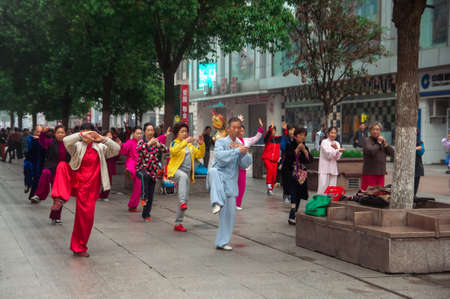 WUHAN,CHINA - April 22, 2019 - People performing exercise in the morning at the city.のeditorial素材