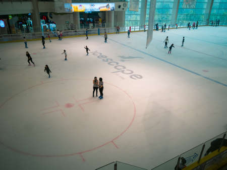 Putrajaya, Malaysia - September 15, 2019: People ice skating at the Icescape rink in IOI Mall.のeditorial素材