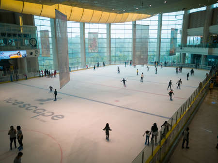 Putrajaya, Malaysia - September 15, 2019: People ice skating at the Icescape rink in IOI Mall.のeditorial素材