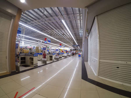 Bangi, Malaysia - 8 April 2020: Few customer during lockdown or movement control order at the counter of the Tesco supermarket.のeditorial素材