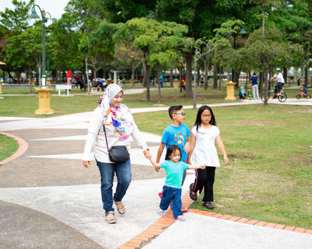 Bangi, Malaysia - Oct 6, 2019 : Families having fun at the Taman Tasik Cempaka garden park in the morning.のeditorial素材