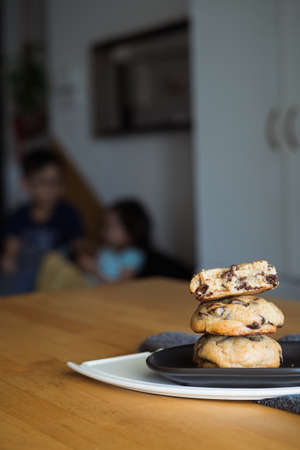 Soft and chewy chocolate chip cookies on a wooden table