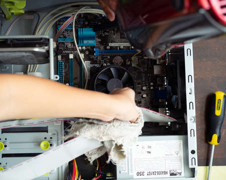Kuala Lumpur, Malaysia - May 22, 2020:  Cleaning and fixing the personal computer (PC) with a vacuum...