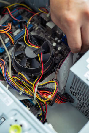 Kuala Lumpur, Malaysia - May 22, 2020:  Cleaning and fixing the personal computer (PC) with a vacuum...