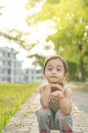Portrait of a toddler walking outdoor. Enjoying nature.の写真素材