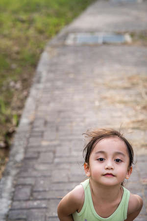 Portrait of a toddler in outdoor. Enjoying nature.の写真素材