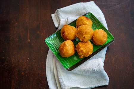 Fried getuk ubi is Malaysian snack food made from tapioca. Fried and served on a banana leaf.
