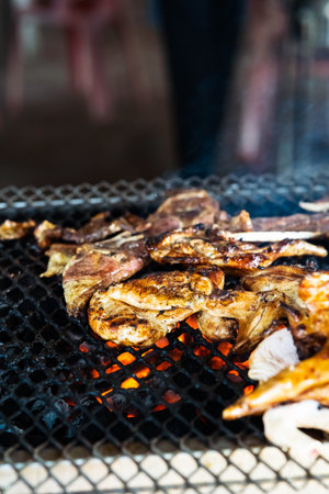 Ayam bakar or known as charcoal-grilled chicken. Ayam bakar literally means "roasted chicken", in the smoky burning process.の写真素材