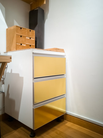 Modern cabinet with golden and white colour.の写真素材