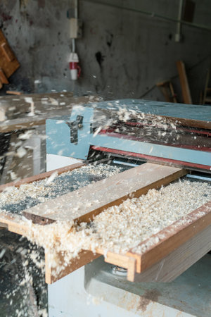 Automated sanding machine for wood boards. Wood dusts scattered everwhere.の写真素材
