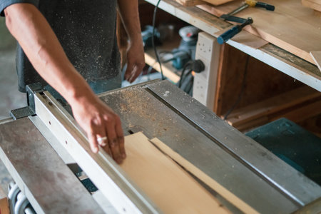 texture of color wood dust sparks over the table, view in the carpenter workshop.の写真素材